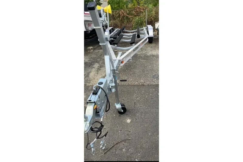 The Image of 2025 SEA LION SA-23-5300 BE boat trailer on pavement, featuring sturdy metal frame. - 1