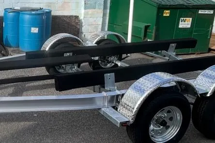 Slide: The Image of 2025 Sea-Lion SA-23-5300 BE boat trailer with dual axles and protective fenders. - 2