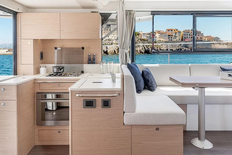 Slide: The Image of Interior of 2026 Beneteau Swift Trawler 41 Sedan, featuring modern kitchen and seating area. - 8