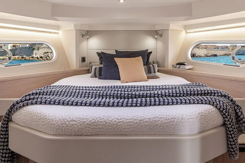 Slide: The Image of Luxurious bedroom interior of 2026 Beneteau Swift Trawler 41 Sedan yacht. - 9