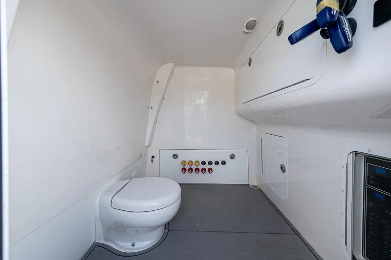 Slide: The Image of Interior of 2021 Invincible 40 Catamaran bathroom with modern fixtures and control panel. - 13