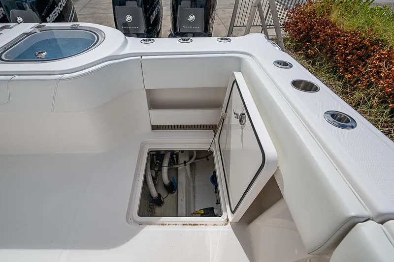 Slide: The Image of Invincible 40 Catamaran 2021 deck with open hatch and storage compartment. - 17