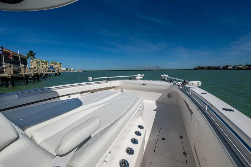 Slide: The Image of Invincible 40 Catamaran 2021 on calm waters, showcasing spacious deck and luxurious seating. - 19