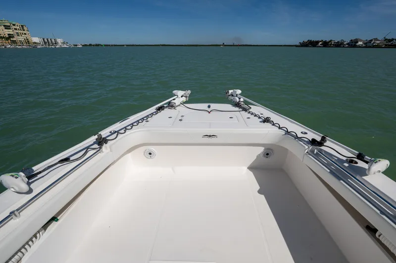 Slide: The Image of Invincible 40 Catamaran 2021 on calm waters, showcasing spacious deck and modern design. - 24