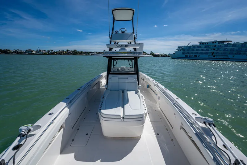 Slide: The Image of 2021 Invincible 40 Catamaran on water, clear sky, luxury boating experience. - 29