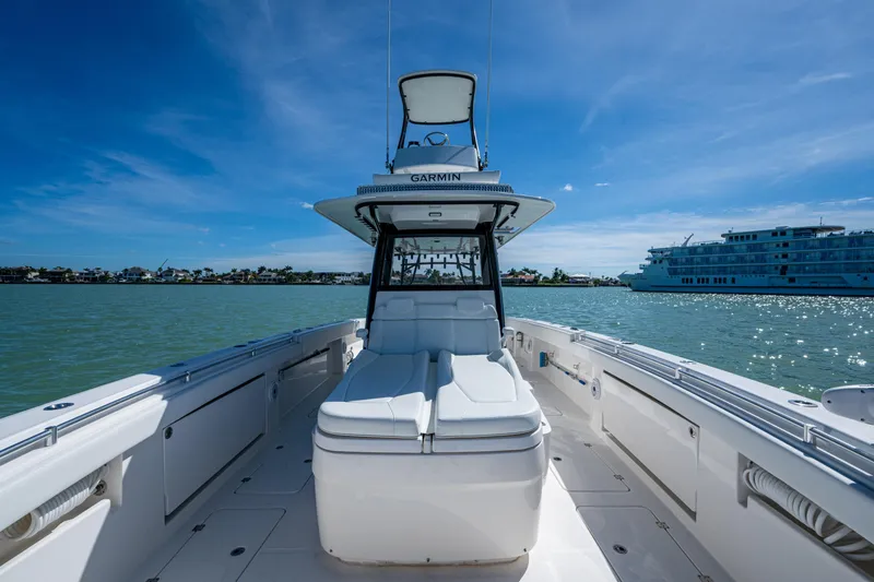 Slide: The Image of 2021 Invincible 40 Catamaran on water, clear sky, luxury boating experience. - 30