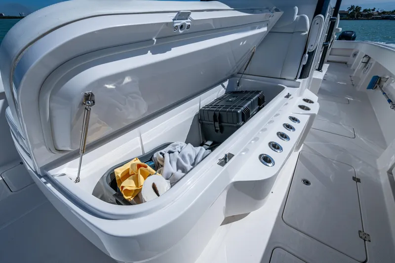 Slide: The Image of Open storage compartment on 2021 Invincible 40 Catamaran, featuring organized gear and accessories. - 32