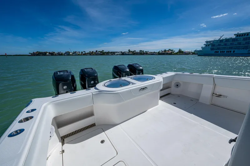 Slide: The Image of 2021 Invincible 40 Catamaran with four outboard engines on calm water. - 37
