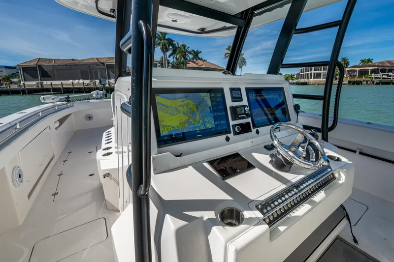 Slide: The Image of 2021 Invincible 40 Catamaran cockpit with advanced navigation system and sleek design. - 50