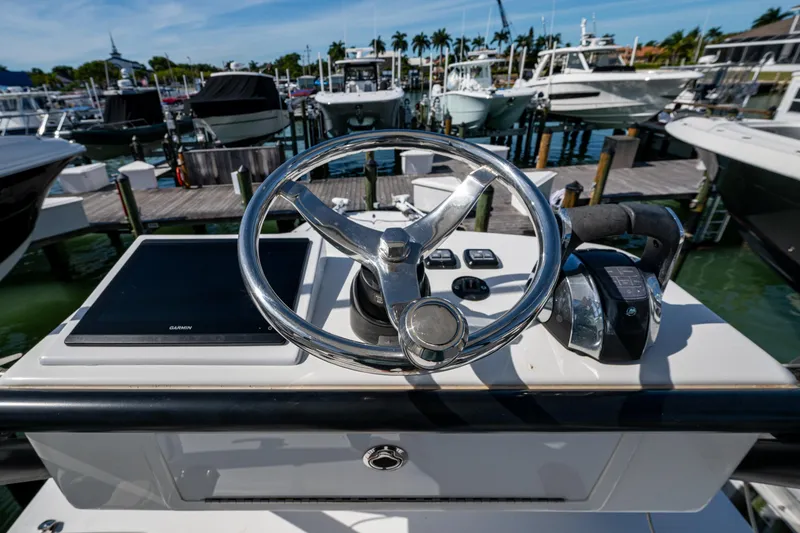 Slide: The Image of Helm of 2021 Invincible 40 Catamaran with Garmin display at marina. - 67