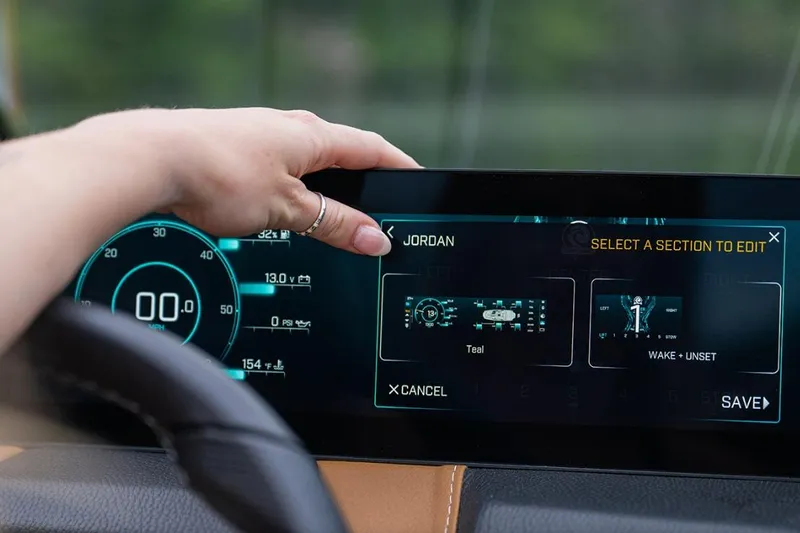 Slide: The Image of Touchscreen interface of 2026 Malibu Wakesetter 21 LX boat, displaying speed and settings. - 11