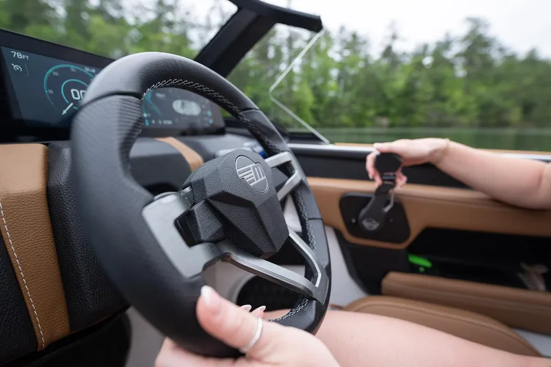 Slide: The Image of Manufacturer Provided Image: 2026 Malibu Wakesetter 21 LX steering wheel and dashboard close-up. - 5