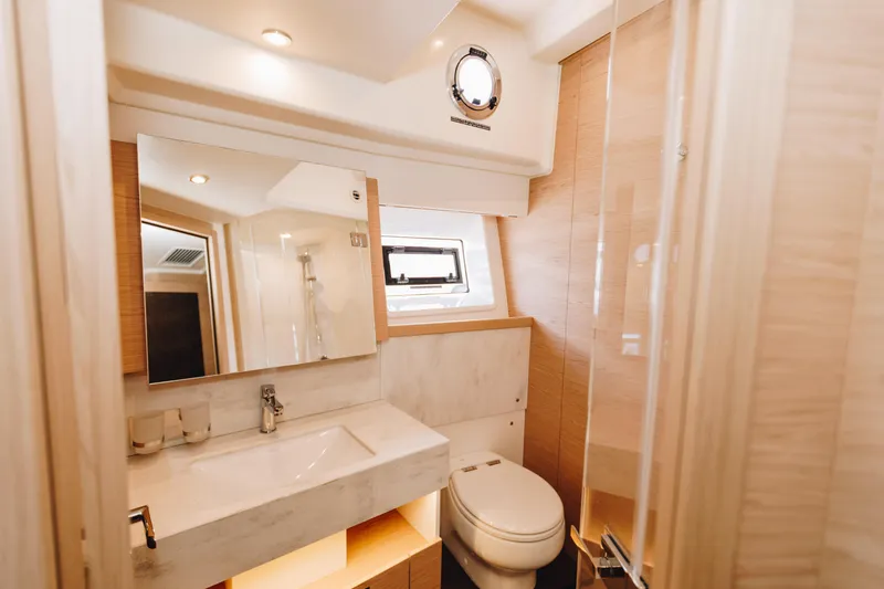 Slide: The Image of Luxurious bathroom in 2024 Beneteau Grand Trawler 62 yacht, featuring modern fixtures and elegant design. - 40