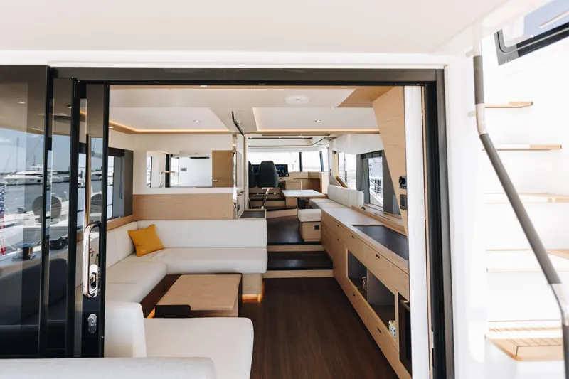 Slide: The Image of Luxurious interior of 2024 Beneteau Grand Trawler 62 yacht with modern furnishings. - 7