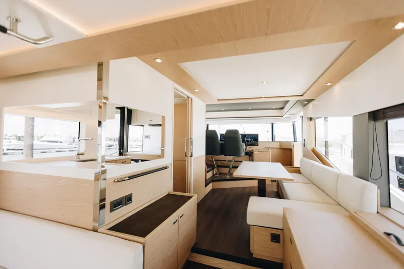 Slide: The Image of Luxurious interior of 2024 Beneteau Grand Trawler 62 yacht, featuring modern design and spacious seating. - 8