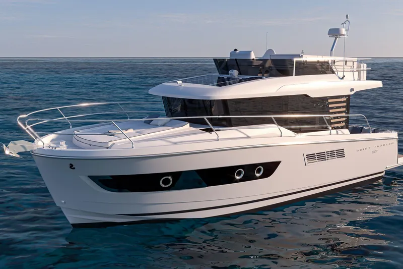 Slide: The Image of 2026 Beneteau Swift Trawler 37 Fly cruising on calm ocean waters. - 21