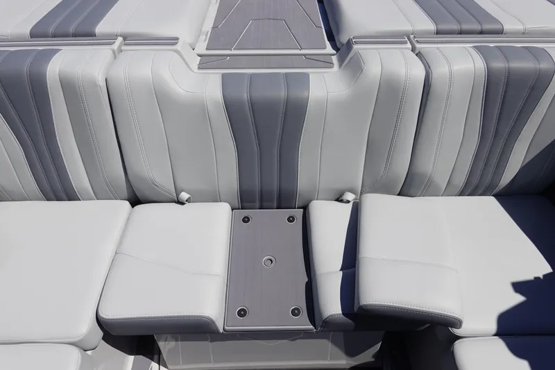 Slide: The Image of 2026 Malibu Wakesetter 22 LSV interior seating with sleek gray upholstery design. - 13