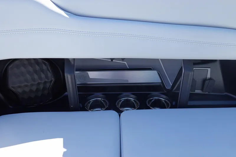 Slide: The Image of Interior of 2026 Malibu Wakesetter 22 LSV featuring cup holders and sleek design elements. - 19