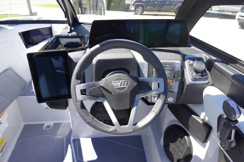 Slide: The Image of 2026 Malibu Wakesetter 22 LSV dashboard with modern steering and digital displays. - 25