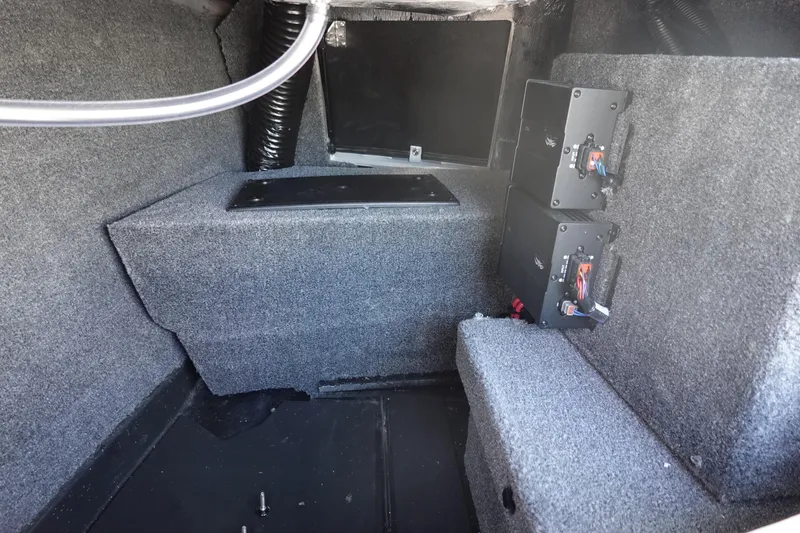 Slide: The Image of Interior view of 2026 Malibu Wakesetter 22 LSV boat with carpeted storage area. - 28