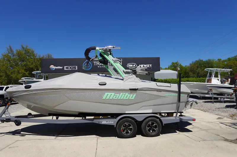 Slide: The Image of 2026 Malibu Wakesetter 22 LSV boat on trailer, covered and parked outdoors. - 44