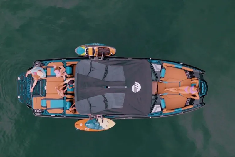 Slide: The Image of Aerial view of 2026 Malibu Wakesetter 22 LSV with passengers relaxing on deck. - 6
