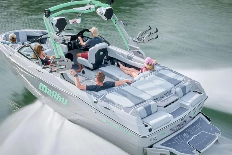 Slide: The Image of 2026 Malibu Wakesetter 22 LSV cruising on water with passengers enjoying the ride. - 7