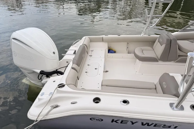 Slide: The Image of 2024 Key West 239 DFS boat with Yamaha engine, featuring spacious seating and sleek design. - 4