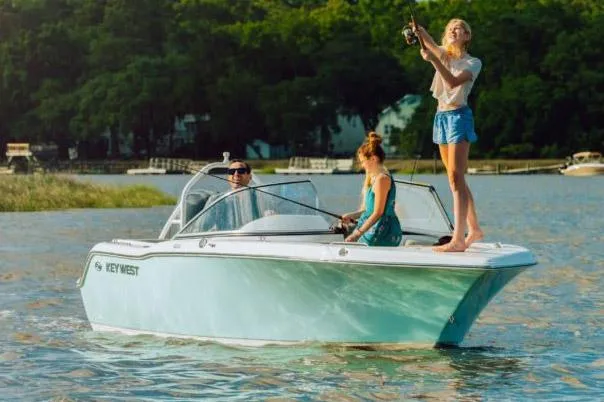 Slide: The Image of 2024 Key West 239 DFS boat helm with steering wheel and control panel. - 6