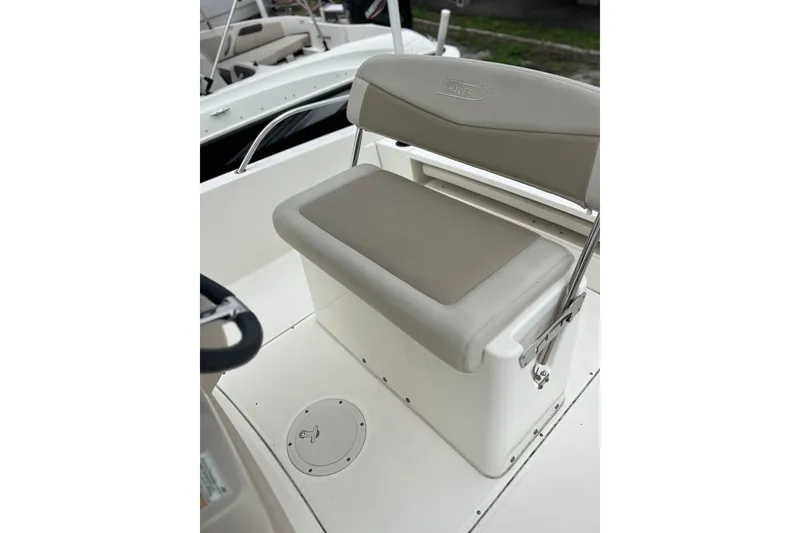 Slide: The Image of 2018 Boston Whaler 210 Dauntless boat seat with storage compartment. - 18