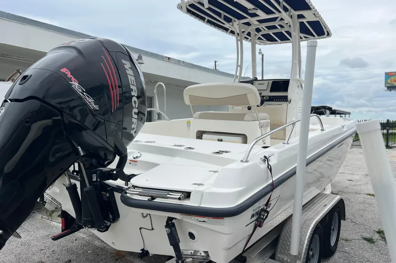 Slide: The Image of 2018 Boston Whaler 210 Dauntless boat with Mercury engine on trailer. - 4