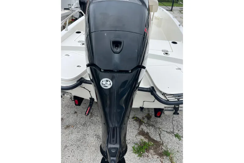 Slide: The Image of 2018 Boston Whaler 210 Dauntless boat with a powerful outboard motor, rear view. - 7