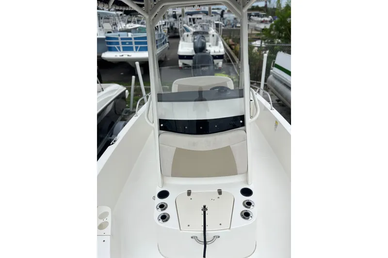 Slide: The Image of 2018 Boston Whaler 210 Dauntless boat interior with console and seating. - 9
