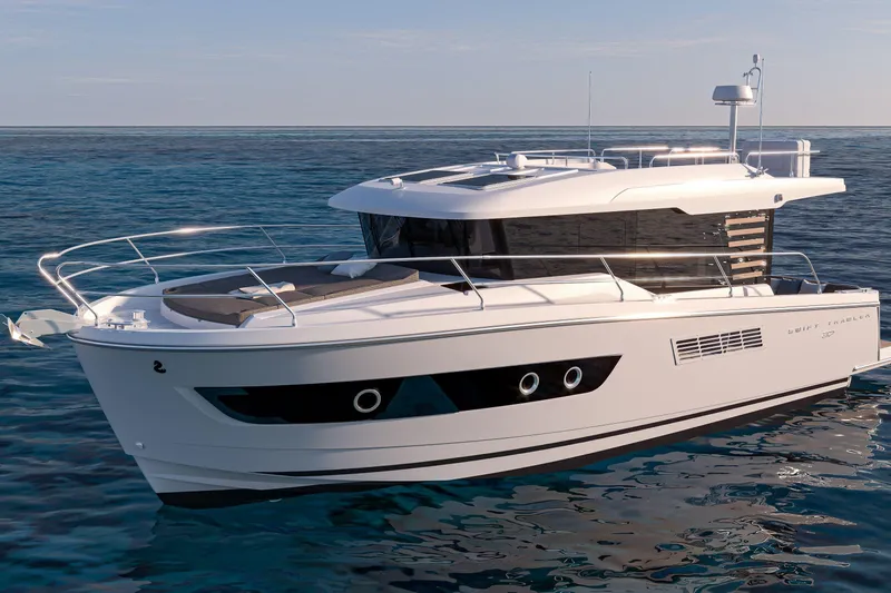 Slide: The Image of 2026 Beneteau Swift Trawler 37 Sedan cruising on open water. - 3