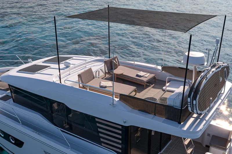 Slide: The Image of 2026 Beneteau Swift Trawler 37 Sedan with sunshade, elegant deck, and ocean backdrop. - 6