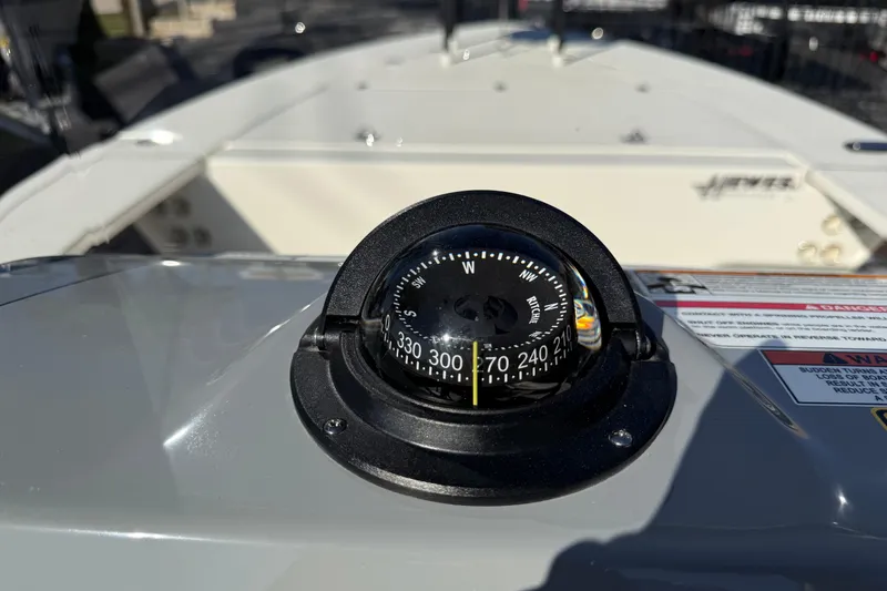 Slide: The Image of Compass on 2026 Hewes Redfisher 21 boat dashboard, showing navigation details. - 15