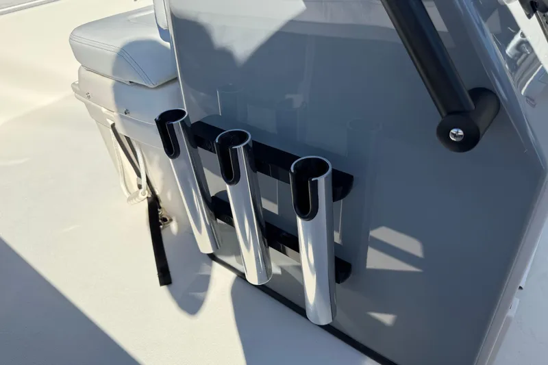 Slide: The Image of 2026 Hewes Redfisher 21 boat interior with rod holders and seating. - 18