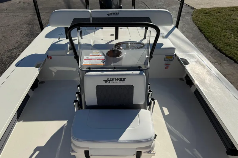 Slide: The Image of 2026 Hewes Redfisher 21 boat interior with seating and steering console. - 19