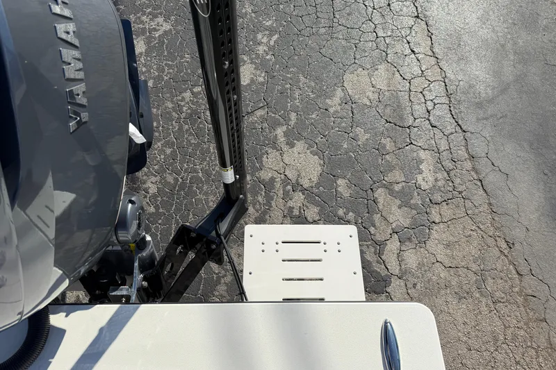 Slide: The Image of 2026 Hewes Redfisher 21 boat with Yamaha engine on cracked pavement. - 30