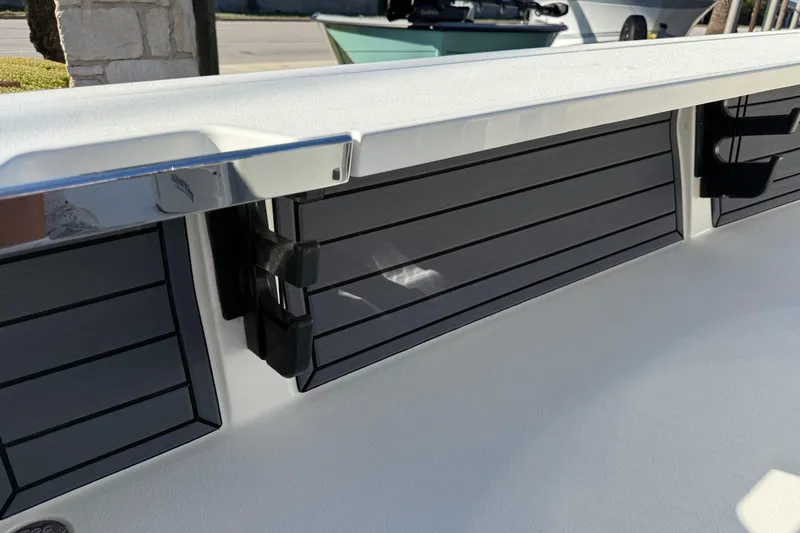 Slide: The Image of 2026 Hewes Redfisher 21 boat interior detail with sleek black paneling. - 34