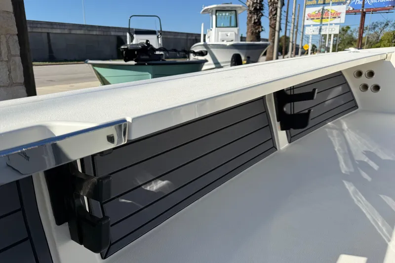 Slide: The Image of 2026 Hewes Redfisher 21 boat interior with sleek design and rod holders. - 35