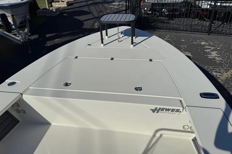 Slide: The Image of 2026 Hewes Redfisher 21 boat deck with storage compartments and seating. - 36