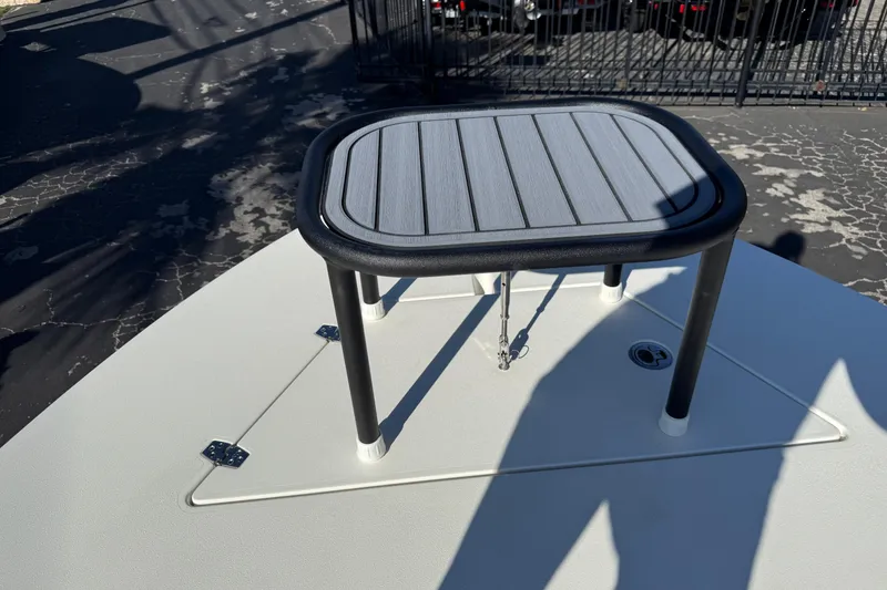 Slide: The Image of 2026 Hewes Redfisher 21 boat deck with elevated platform and storage hatch. - 41