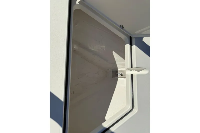 Slide: The Image of Open storage compartment on 2026 Hewes Redfisher 21 boat, showcasing interior details. - 44