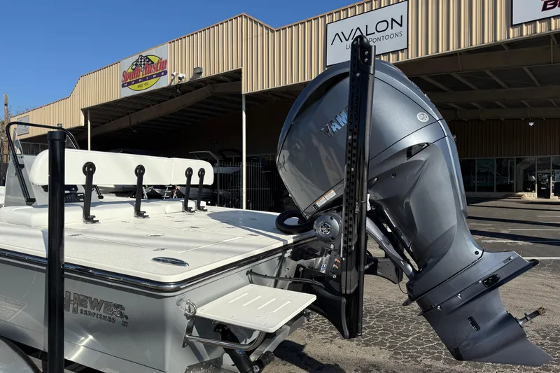 Slide: The Image of 2026 Hewes Redfisher 21 boat with Yamaha outboard motor at dealership. - 5