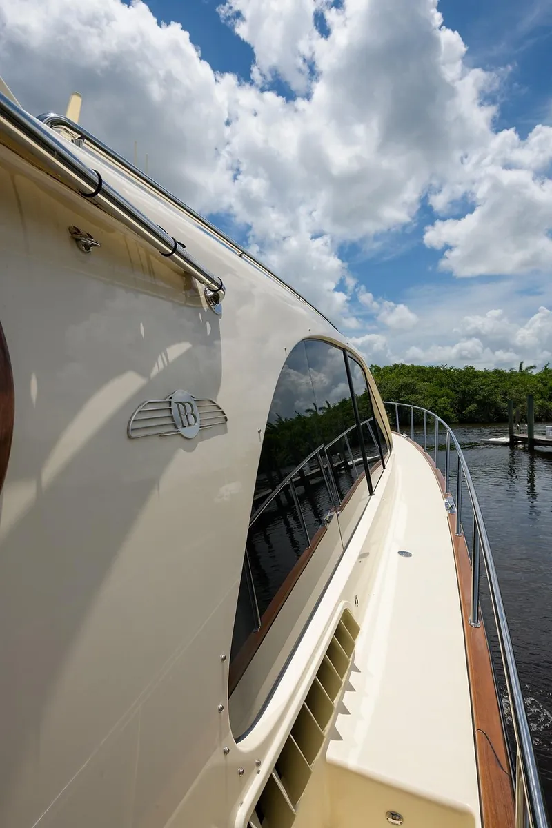 Slide: The Image of Luxurious 2018 Palm Beach Motor Yachts PB55 interior with modern kitchen and scenic water view. - 19