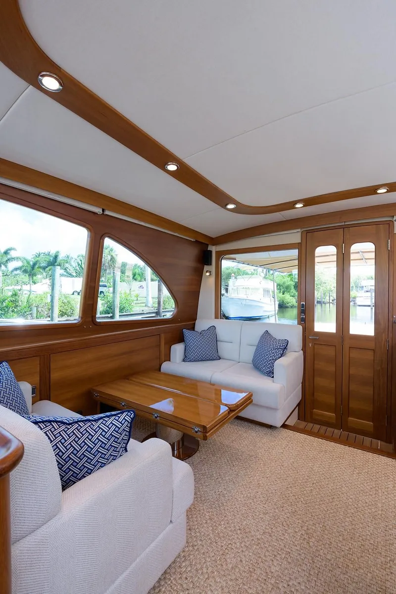 Slide: The Image of Electrical control panel inside 2018 Palm Beach Motor Yachts PB55, featuring switches and meters. - 27