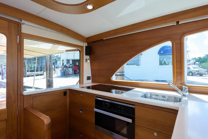 Slide: The Image of Luxurious cabin interior of 2018 Palm Beach Motor Yachts PB55 with elegant bedding and TV. - 35