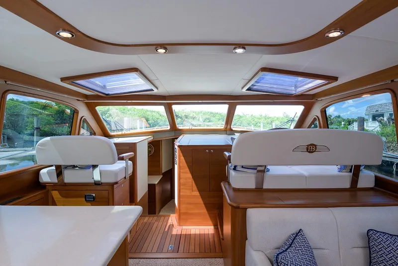 Slide: The Image of Luxurious bathroom in 2018 Palm Beach Motor Yachts PB55, featuring elegant wood cabinetry. - 37