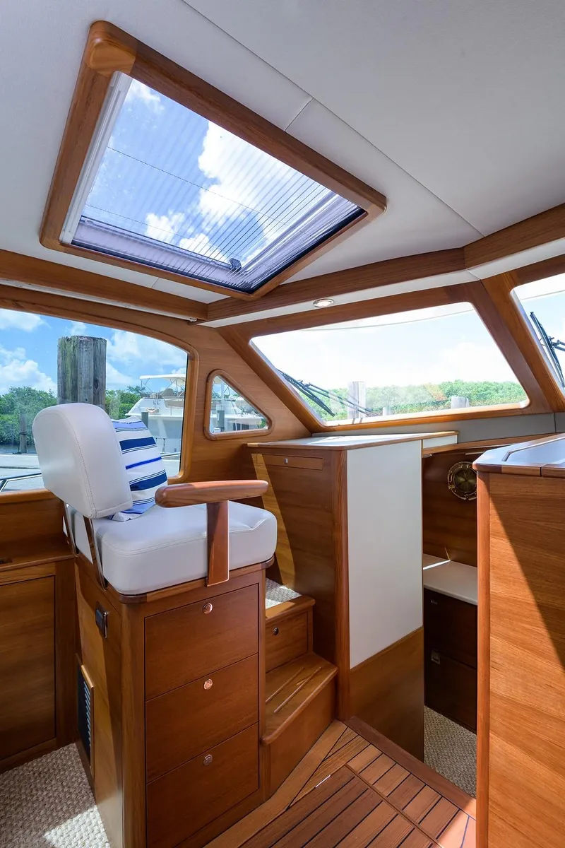 Slide: The Image of Luxurious bathroom interior of 2018 Palm Beach Motor Yachts PB55, featuring elegant wood cabinetry. - 38